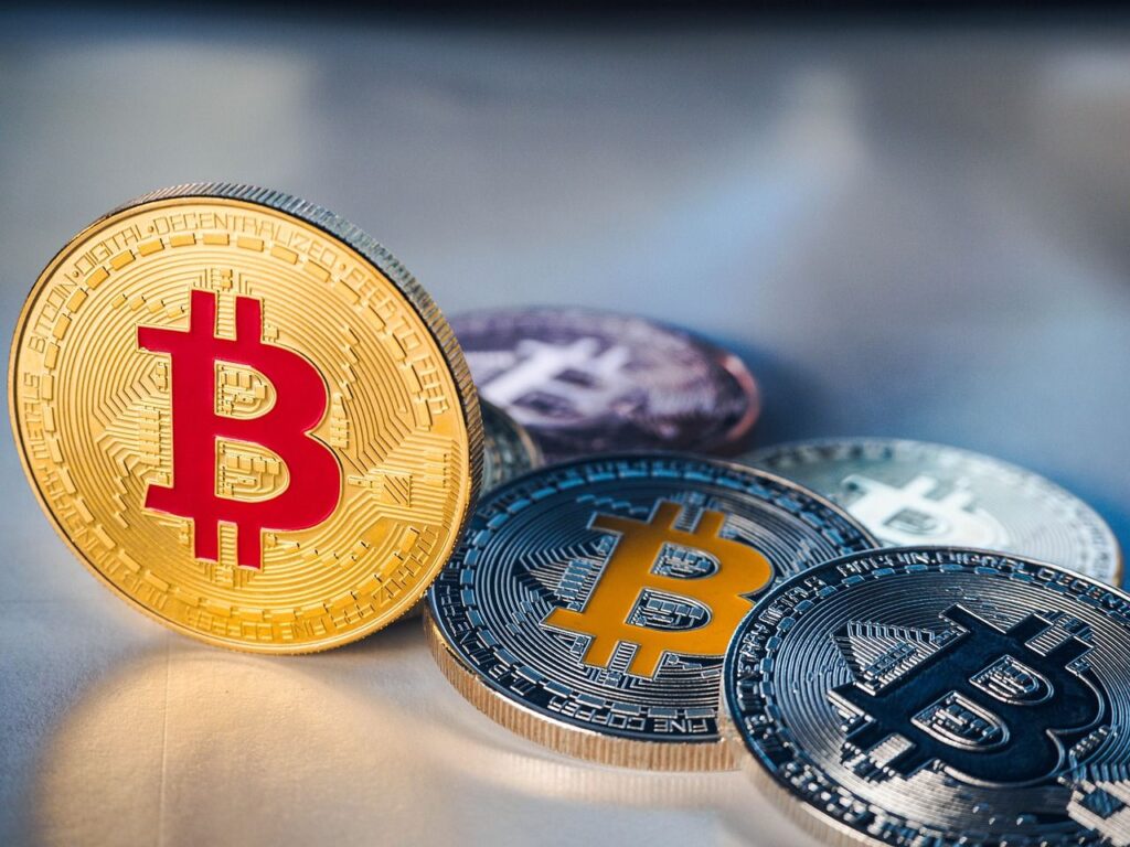 Bitcoin crashes below $100K as recovery signals emerge; GT leads altcoin gains